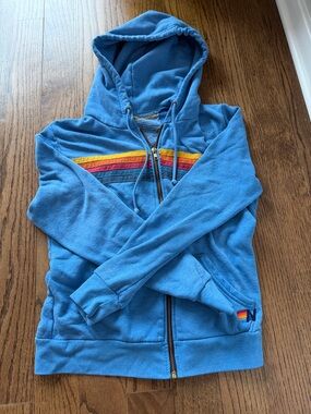 Aviator Nation Blue Zip Hoodie with Rainbow Chest Stripes